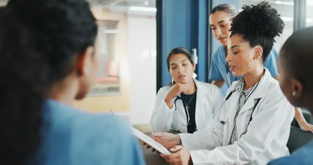 Healthcare professional speaking with a counselor in a private office
