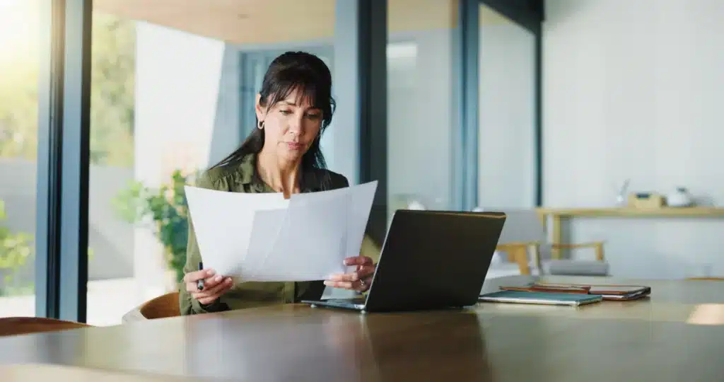 Professional working at a desk in a bright office setting
