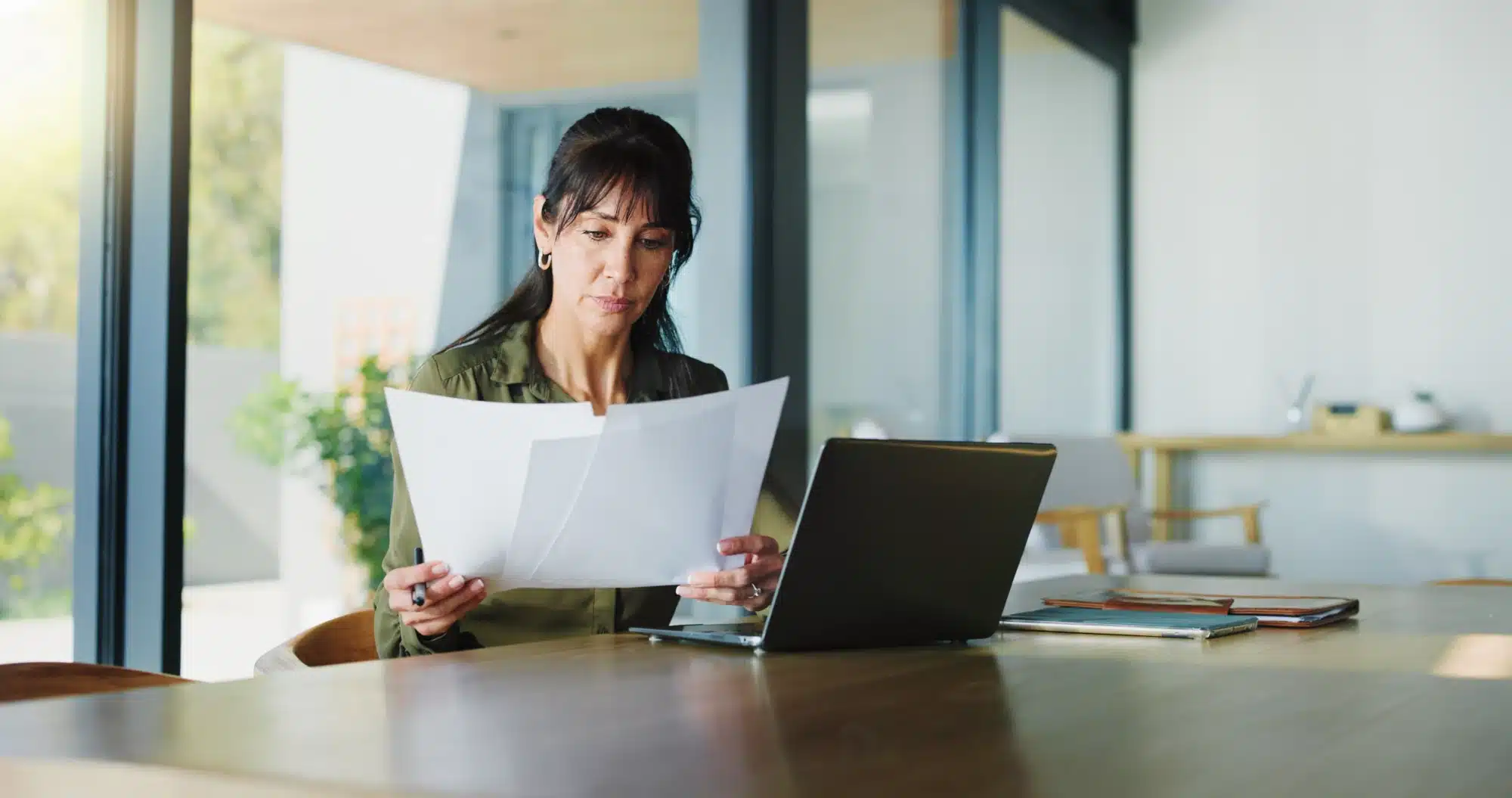 Professional working at a desk in a bright office setting
