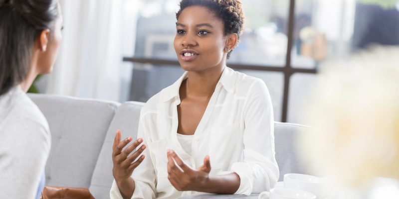 woman meeting with her counselor